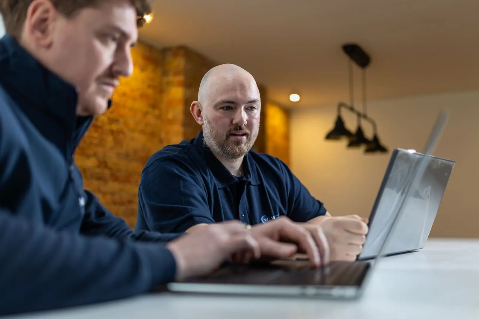 WikiTech senior engineers working with a client