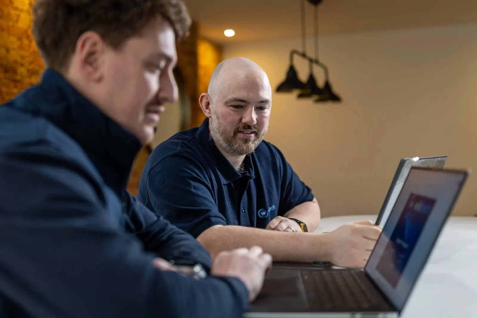 WikiTech engineers reviewing work together